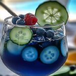 This refreshing martini blends the crisp, clean flavors of cucumber and blueberry with Tito's Handmade Vodka for a unique and delightful cocktail. A perfect drink for warm-weather gatherings or when you're in the mood for something light and fresh!