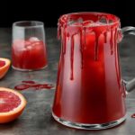 The Blood Orange Vampire Punch is a hauntingly delicious cocktail perfect for Halloween parties. Its deep red hue mimics the color of blood, making it the ultimate spooky drink. The combination of tangy blood orange juice, lime, and sparkling water creates a refreshing yet eerie flavor, while the optional addition of vodka or rum gives it a bit of a bite for the grown-ups. Perfectly festive and frightfully fun!