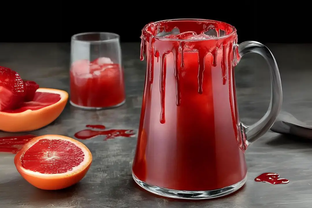 The Blood Orange Vampire Punch is a hauntingly delicious cocktail perfect for Halloween parties. Its deep red hue mimics the color of blood, making it the ultimate spooky drink. The combination of tangy blood orange juice, lime, and sparkling water creates a refreshing yet eerie flavor, while the optional addition of vodka or rum gives it a bit of a bite for the grown-ups. Perfectly festive and frightfully fun!