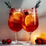 The Cranberry Aperol Spritz is a festive twist on the classic Italian cocktail, combining the bitter orange notes of Aperol with the tartness of cranberries for a perfect seasonal refreshment. This cocktail is ideal for holiday gatherings or whenever you're craving something light, bubbly, and refreshingly bitter-sweet.