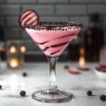 A decadent cocktail that transforms the beloved Cherry Garcia ice cream flavor into liquid form. This sophisticated martini combines chocolate and cherry flavors for a dessert-like drinking experience that's both rich and refreshing.