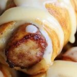 These Breakfast Pigs in a Blanket are a fun and easy way to start your day! A delicious combo of savory sausage wrapped in flaky crescent dough, perfect for brunch, or even a snack.