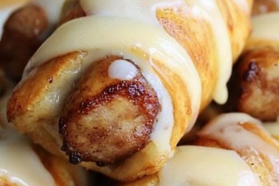 These Breakfast Pigs in a Blanket are a fun and easy way to start your day! A delicious combo of savory sausage wrapped in flaky crescent dough, perfect for brunch, or even a snack.