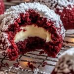 Red velvet snowball cookies are a holiday favorite—soft, buttery, and coated in powdered sugar for a snowy finish. These delightful treats bring festive color and melt-in-your-mouth texture to your dessert table. Perfect for gift-giving, parties, or just indulging with a cup of cocoa!