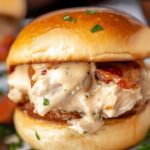 These baked chicken bacon ranch sliders are made with soft slider buns, shredded chicken tossed in a savory ranch sauce with sharp cheese and crispy bacon, then topped with a garlic butter sauce!