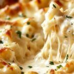 This Chicken Alfredo Casserole is a creamy, cheesy, and comforting dish that combines the richness of Alfredo sauce with tender chicken and pasta. It’s baked to golden perfection, creating a one-pan meal that is easy to prepare and will satisfy the whole family. Perfect for weeknight dinners or a cozy weekend meal!