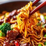 This Sticky Beef Noodles recipe is an irresistible combination of tender beef, flavorful sauce, and chewy noodles. The savory beef is coated in a rich, sticky sauce that clings to each noodle, making every bite a mouthwatering experience. Perfect for a quick weeknight meal or weekend treat