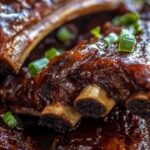 If you’re craving tender, fall-off-the-bone beef ribs packed with smoky, tangy barbecue flavor, this slow cooker recipe is a must-try. Using a slow cooker ensures that the ribs cook low and slow, making them irresistibly juicy and flavorful. Perfect for weeknight dinners or weekend gatherings, these ribs require minimal effort but deliver maximum flavor.