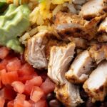 These grilled chicken burrito bowls are fresh, flavorful, and packed with everything you love about a burrito—minus the tortilla. Juicy, smoky grilled chicken sits on a bed of fluffy rice and seasoned beans, topped with your favorite mix-ins like avocado, salsa, and cheese. It’s an easy, satisfying meal that’s great for meal prep or a quick weeknight dinner.