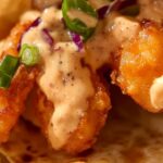 Crispy, spicy, and perfectly balanced with fresh toppings, Air Fryer Bang Bang Shrimp Tacos are the ultimate quick and flavorful dinner. With crunchy shrimp coated in a creamy bang bang sauce, served in warm tortillas, these tacos are a fun, crowd-pleasing meal that’s surprisingly easy to make.