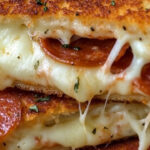 If you love pizza and grilled cheese, this recipe is the ultimate mashup! Gooey mozzarella, savory marinara sauce, and your favorite pizza toppings sandwiched between buttery, crispy bread—it’s a quick and easy comfort food everyone will adore.