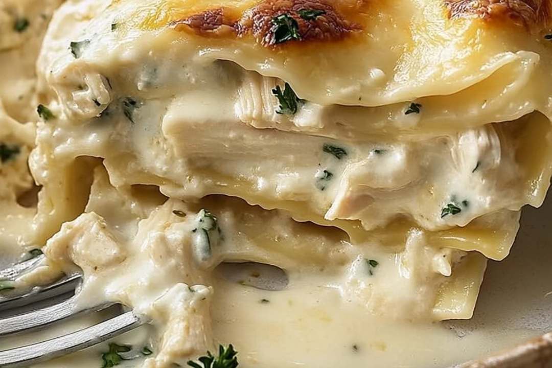 This Cheesy Chicken Alfredo Lasagna is the ultimate comfort meal. Layers of tender chicken, creamy Alfredo sauce, and gooey melted cheese come together in this rich and satisfying dish. Perfect for family dinners or a make-ahead meal, this lasagna is sure to be a favorite.