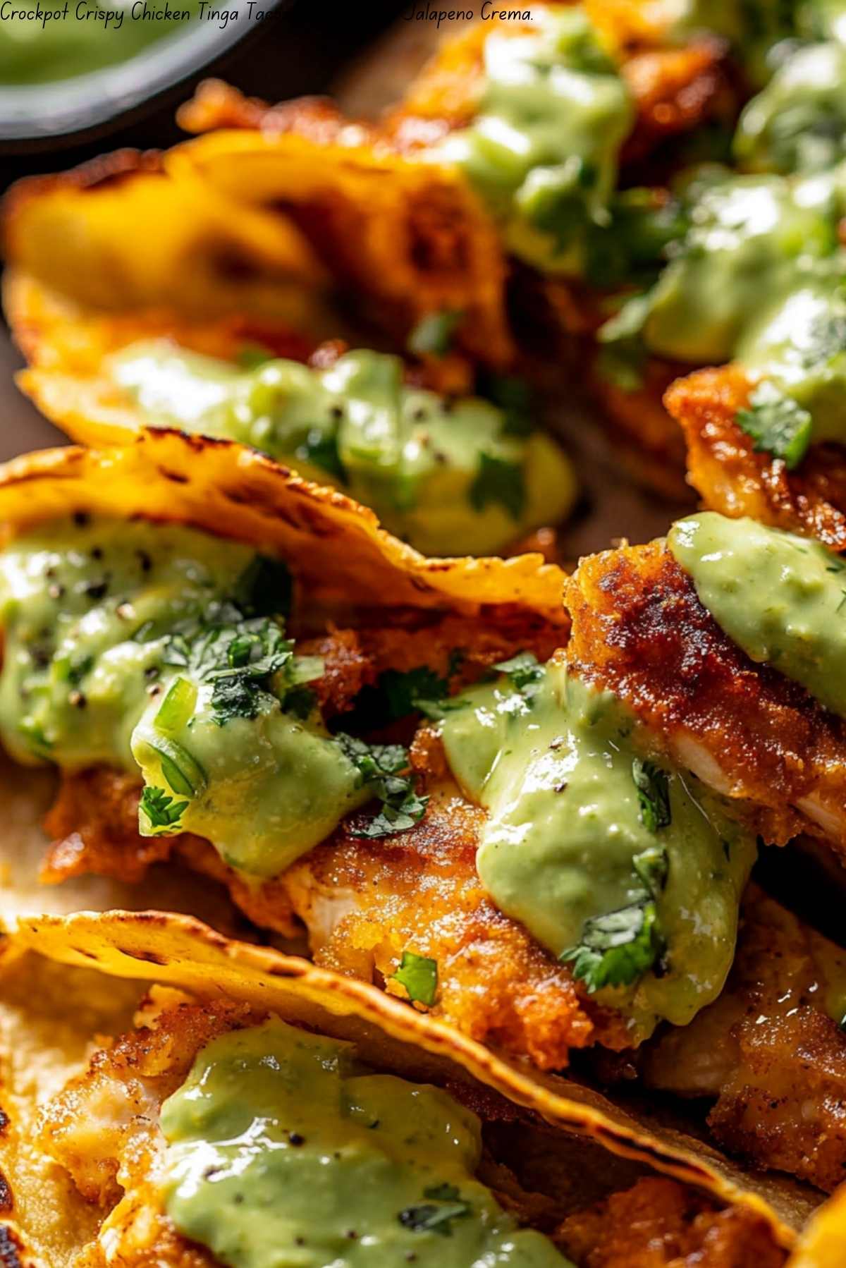 Crockpot Crispy Chicken Tinga Tacos with Avocado Jalapeño Crema.