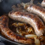 Oven Braised Beer Brats with Caramelized Onions Recipe