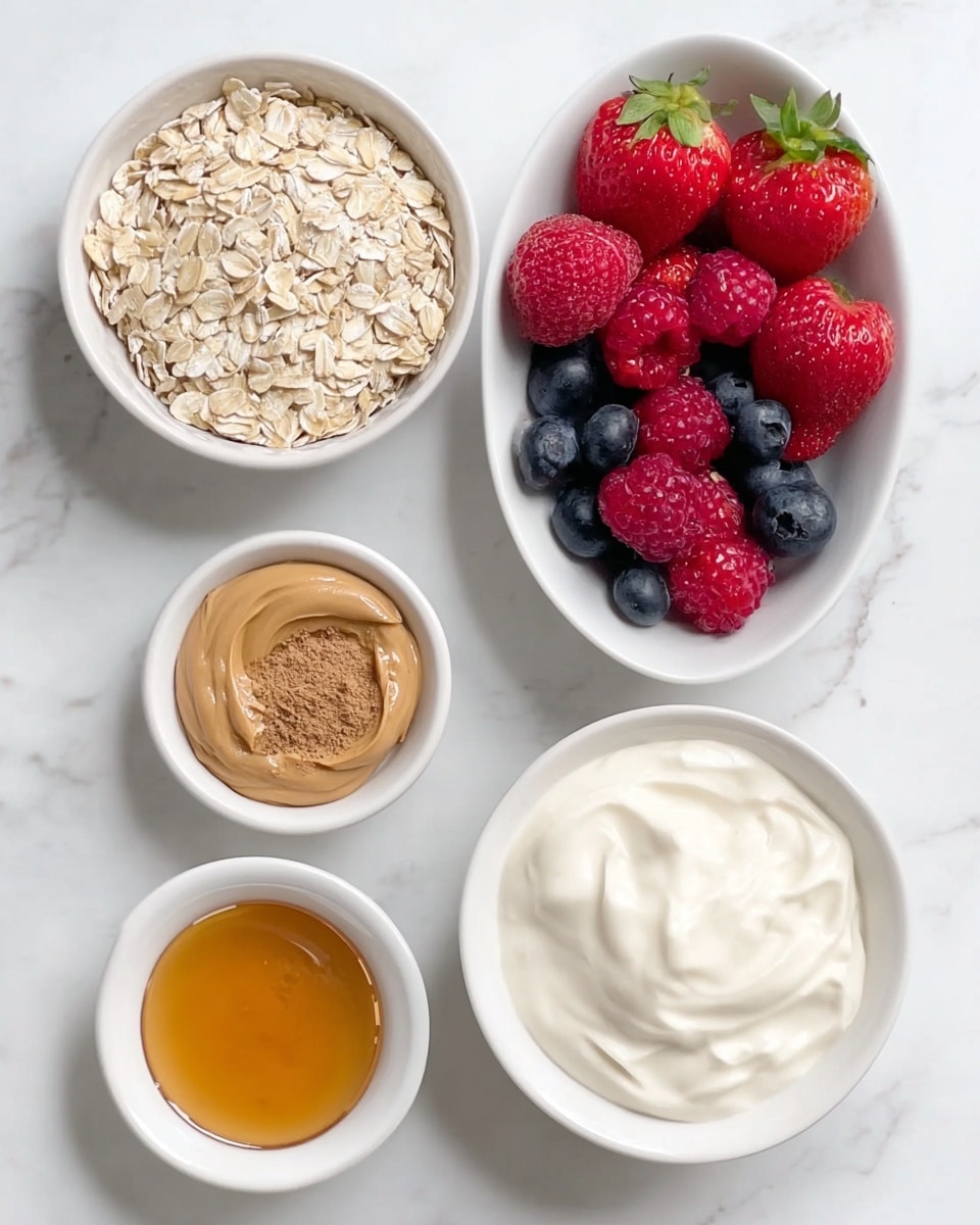 The image shows six white bowls and a white boat-shaped dish on a white marbled surface. The largest round bowl contains creamy white yogurt with a thick texture. Next to it, a similar-sized round bowl is filled with pale, rolled oats with a rough texture. A small round bowl holds smooth, light brown peanut butter with slight swirls. Another small bowl contains golden honey with a shiny, liquid surface. A third small bowl has a fine, light brown powder, likely cinnamon. The white boat-shaped dish is filled with fresh red strawberries, deep red raspberries, and dark blue blueberries, all with a shiny and ripe appearance. photo taken with an iphone --ar 4:5 --v 7