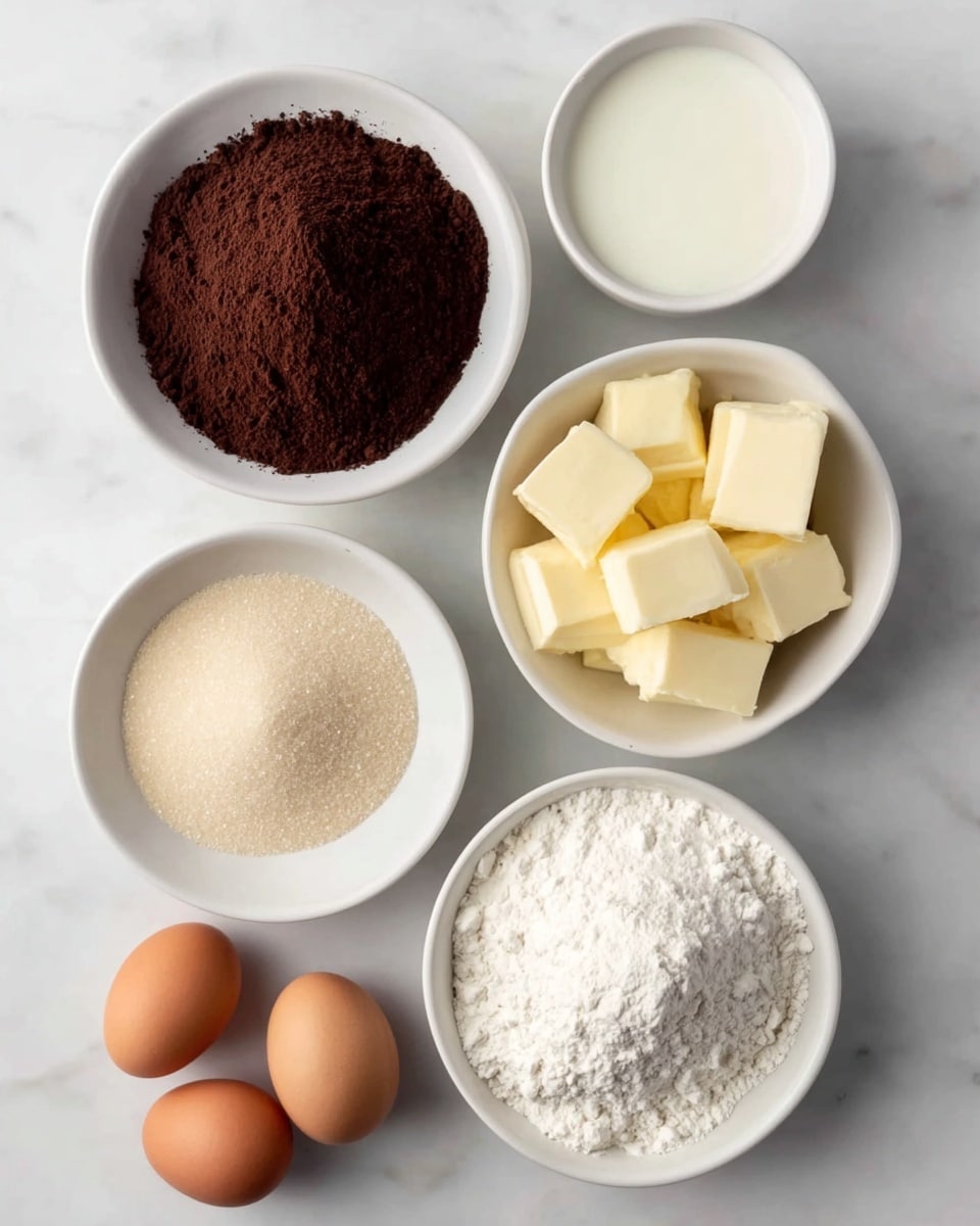 The image shows six baking ingredients arranged neatly on a white marbled surface. There are five white bowls with different contents: a mound of dark brown cocoa powder in one bowl, a smaller bowl with a smooth white liquid, another bowl filled with soft yellow butter cut into cubes, a bowl full of white granulated sugar, and another bowl holding a heap of white flour. Next to the bowls, there are three brown eggs placed together. All the ingredients look fresh and are clearly separated in individual white dishes. photo taken with an iphone --ar 4:5 --v 7