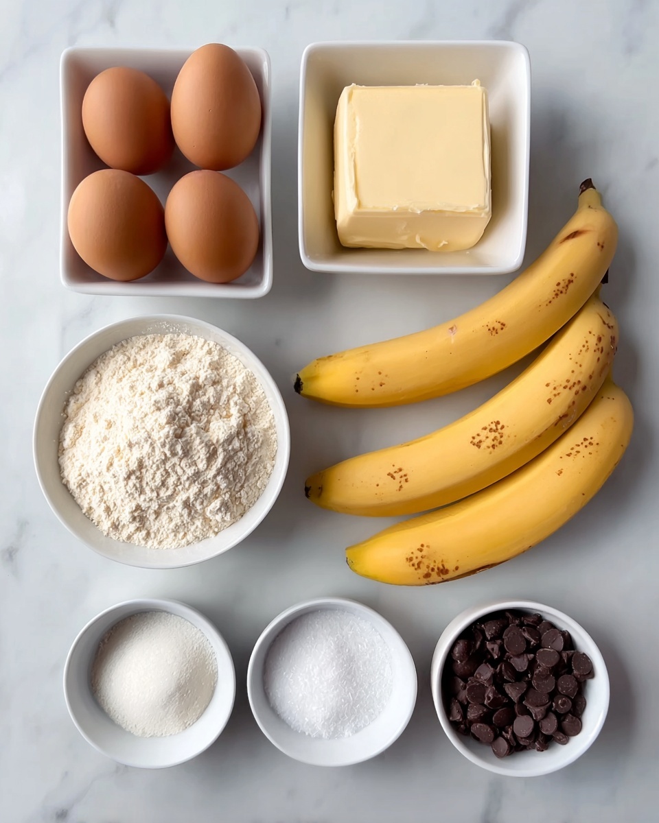 The image shows baking ingredients neatly arranged on a white marbled surface. There are three brown eggs grouped on the top left, next to a white square bowl filled with a light tan, smooth paste. To the right of the bowl, two yellow bananas with brown spots lie side by side. Below the eggs is a rectangular piece of pale butter in a square white dish. Nearby are two small round white bowls, one with white granulated sugar and the other with white powder, likely baking soda or powder. At the bottom, two larger white bowls hold a heap of white flour and a pile of dark chocolate chips, positioned side by side. All items are clearly visible with soft, natural lighting. Photo taken with an iphone --ar 4:5 --v 7