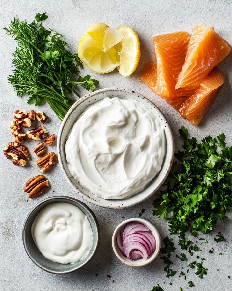 A round cheese ball covered with chopped nuts and green herbs is placed in the center of a white plate. Around the cheese ball, there is a single layer of square-shaped crackers arranged neatly. The plate sits on a white marbled surface, and the background is plain white with a blurred white plate and wooden item partly visible. The texture of the cheese ball is rough with small nut pieces and flecks of green herbs spread evenly on the surface. photo taken with an iphone --ar 4:5 --v 7