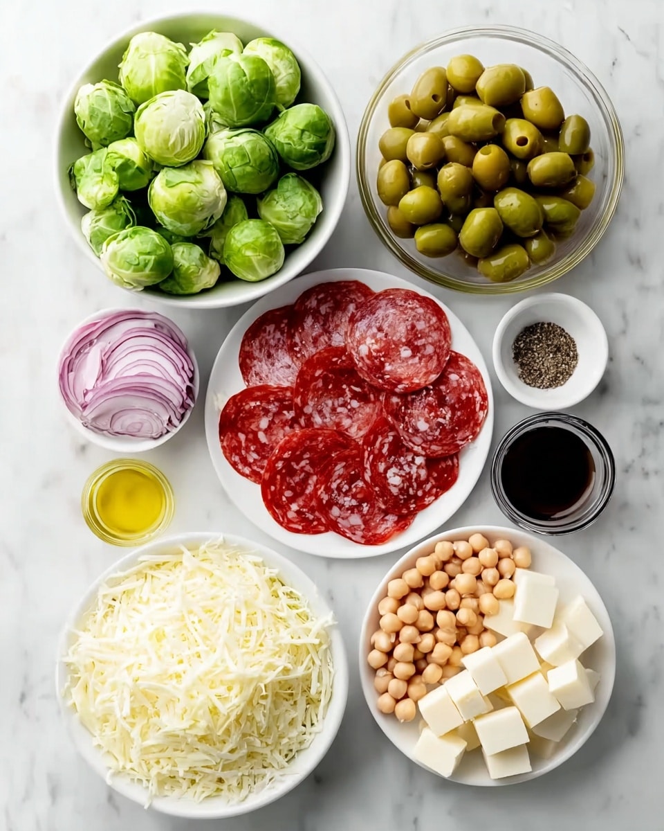 Italian Brussels Sprouts Salad Recipe 4 The image shows several white bowls on a white marbled surface, each holding different ingredients. The largest bowl at the bottom contains bright green Brussels sprouts stacked high. Above that to the right is a white bowl with thinly sliced reddish-pink salami and pepperoni arranged in overlapping layers. Next to it is a bowl of grated white cheese with a shredded texture. Below that, there are thin slices of purple-red onion in a small square white bowl. Above the Brussels sprouts to the left, there is a bowl with white chickpeas, another with light yellow cubed cheese, and a small bowl with shiny green olives. In the center, there is a clear glass bowl holding golden olive oil and a small white bowl with dark balsamic vinegar. A tiny bowl with ground black pepper sits in the middle of the setup. The overall look is fresh and colorful with all the ingredients neatly placed. photo taken with an iphone --ar 4:5 --v 7