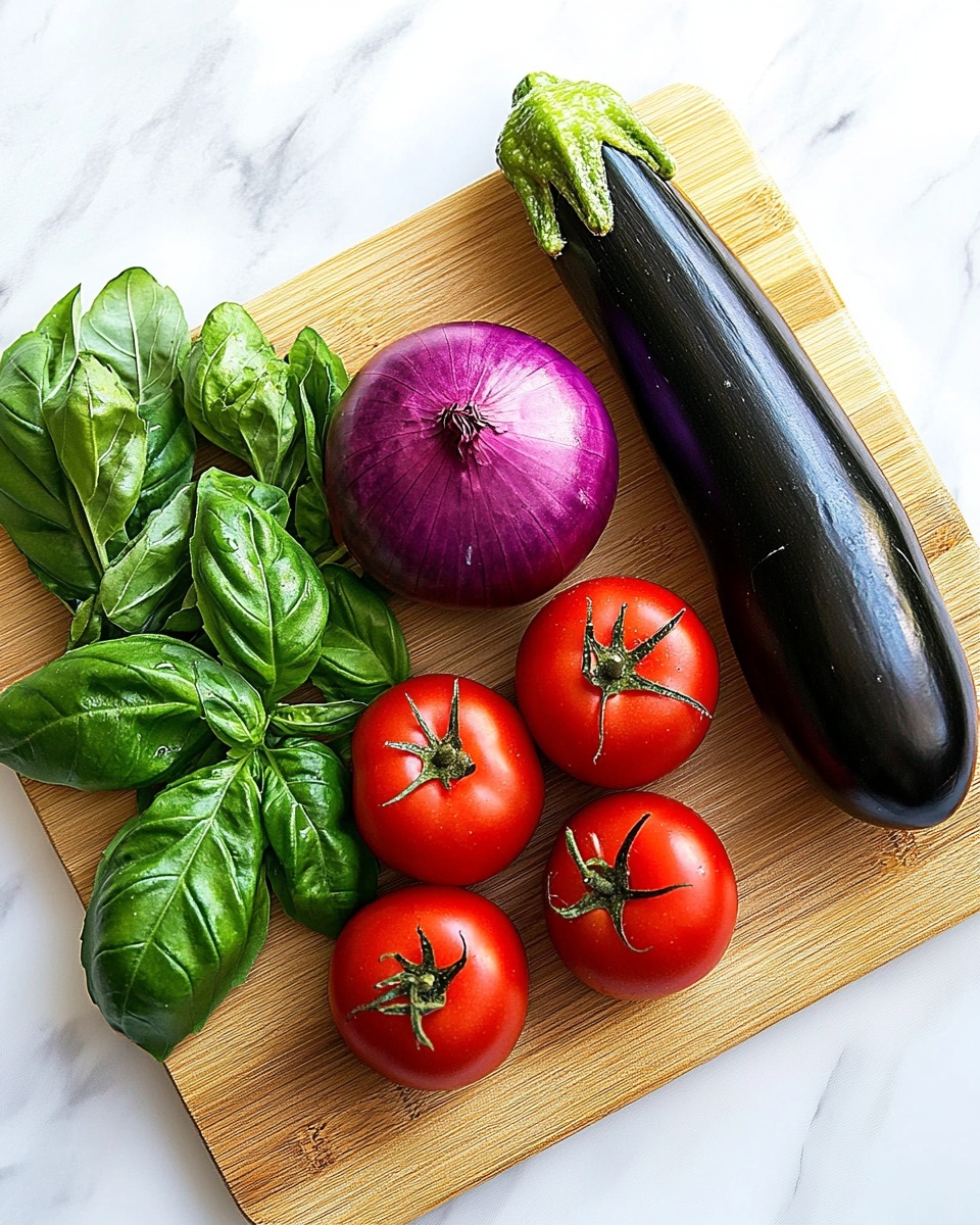 Oven Roasted Ratatouille Recipe 2 The image shows a wooden cutting board with fresh vegetables arranged on top, placed on a white marbled surface. From left to right, there are bright green basil leaves with visible veins in the lower-left corner, three ripe red tomatoes above them, a large shiny purple onion next to the tomatoes, a long smooth dark purple eggplant to the right of the onion, and two glossy green zucchinis placed diagonally on the right side. The colors are vibrant, the textures vary from smooth to leafy, and the vegetables are closely grouped but not overlapping. Photo taken with an iphone --ar 4:5 --v 7